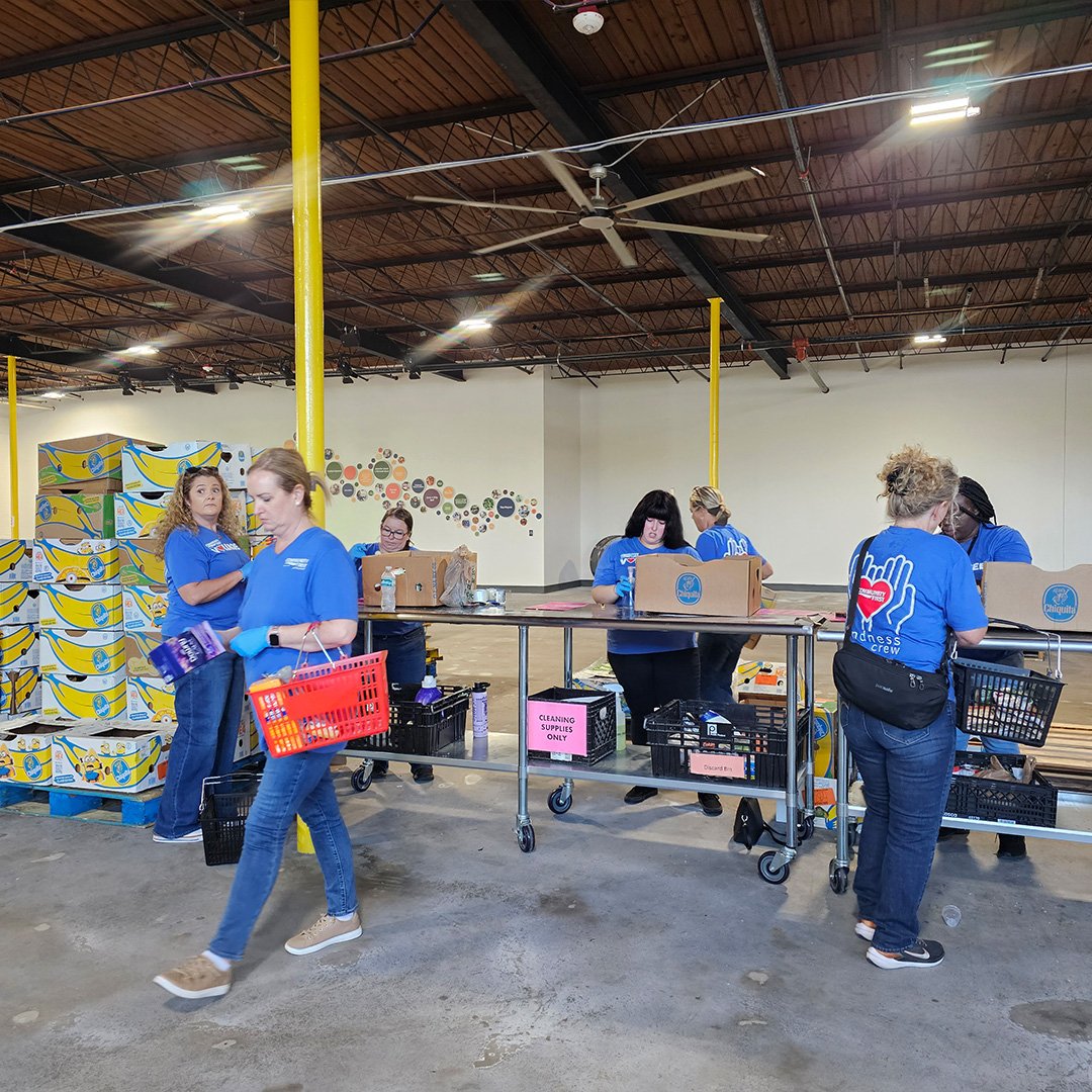 Volunteers sorting food. Volunteers sorting food.