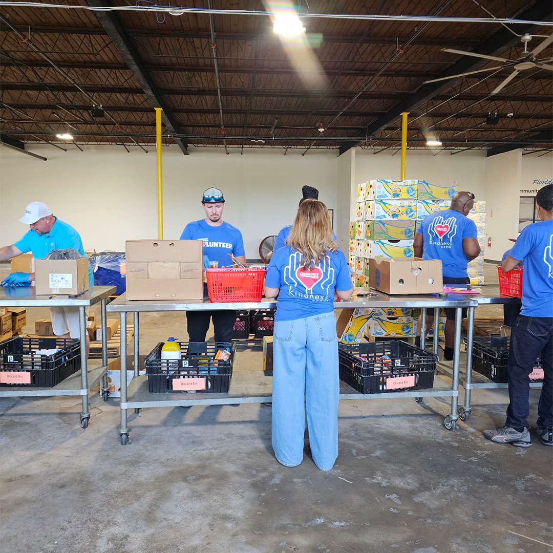 Volunteers sorting food. Volunteers sorting food.