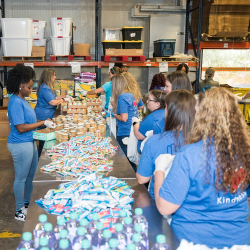 Group of volunteers sorting food.