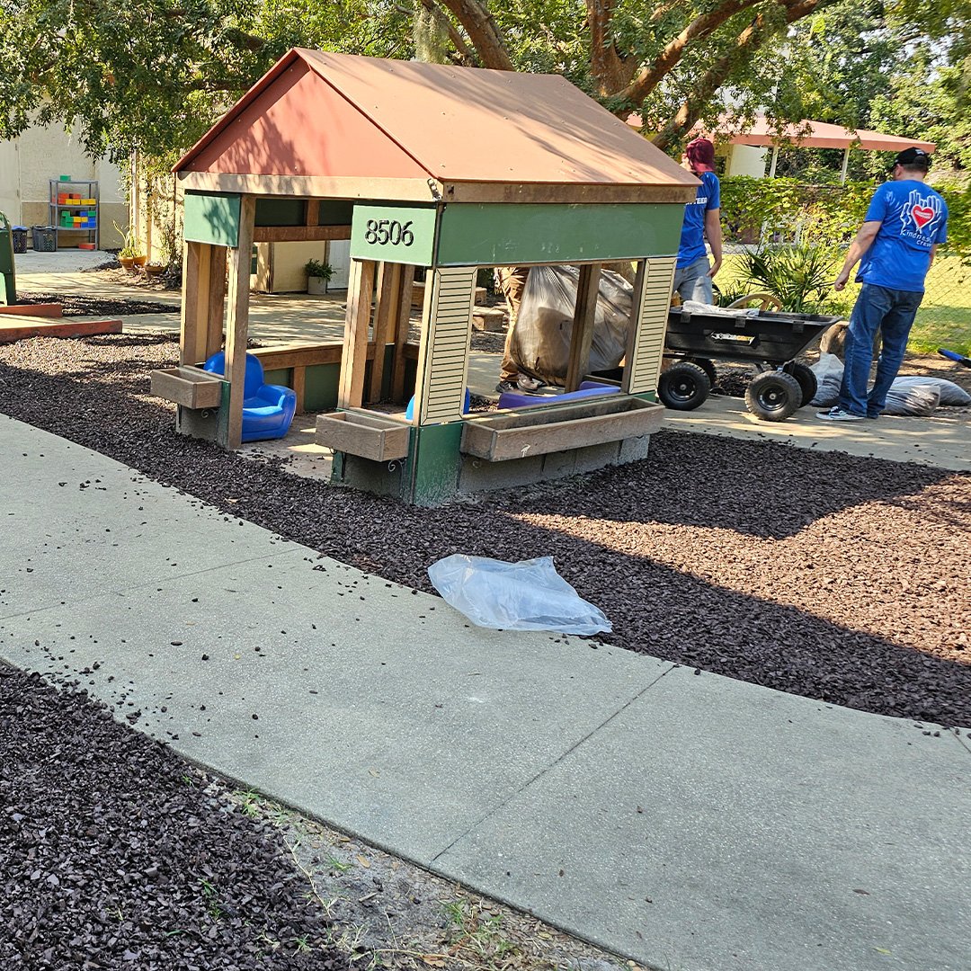 Volunteers with wagon doing yard work. Volunteers with wagon doing yard work.