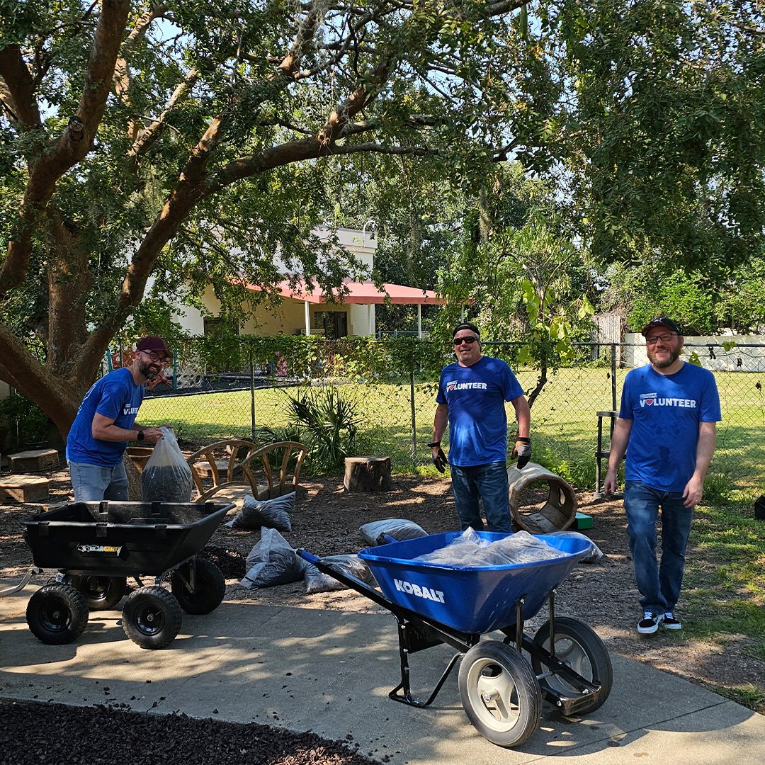 Volunteers laying mulch. Volunteers laying mulch.