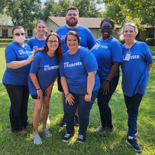 Group of volunteers smiling.