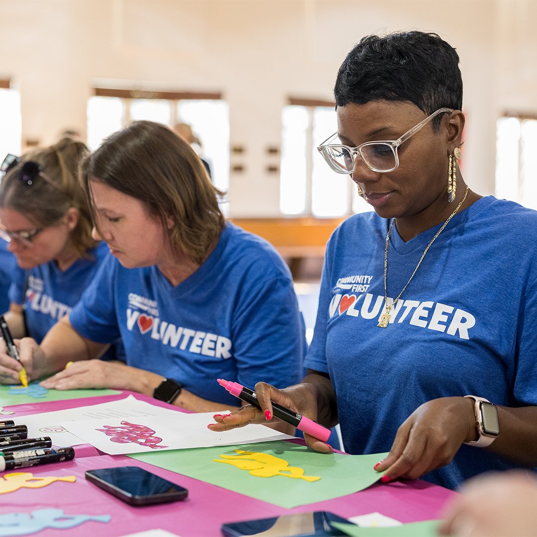 Volunteers working on crafts.