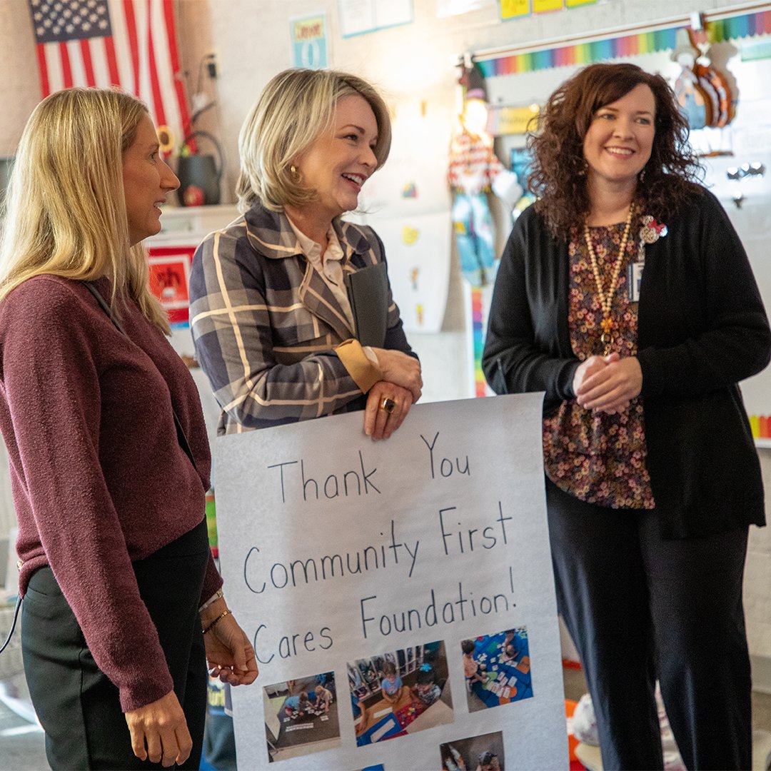 Volunteers smiling from the Community First Cares Foundation.