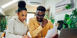 Couple looking over paperwork.