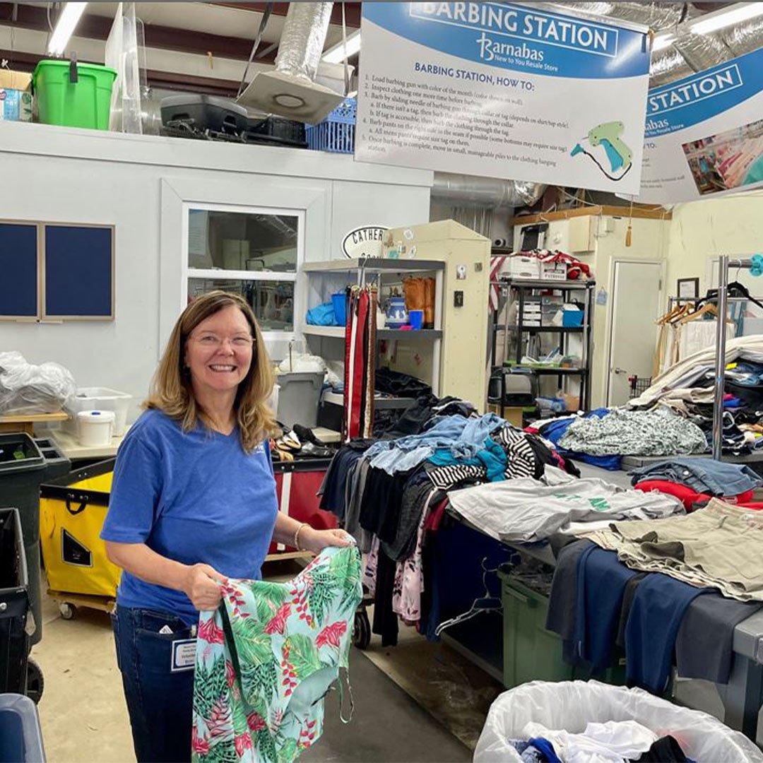 Volunteer folding clothes