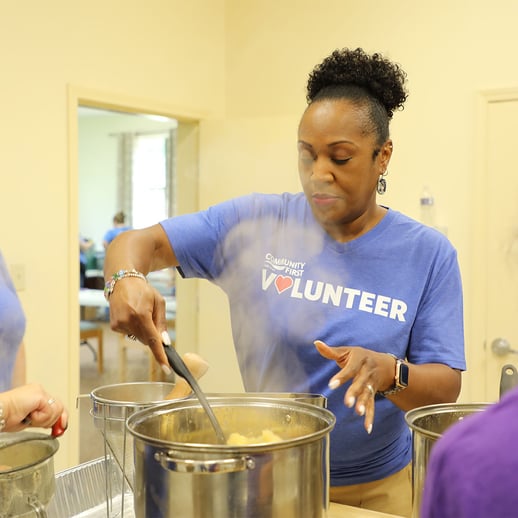 Volunteer making apple butter