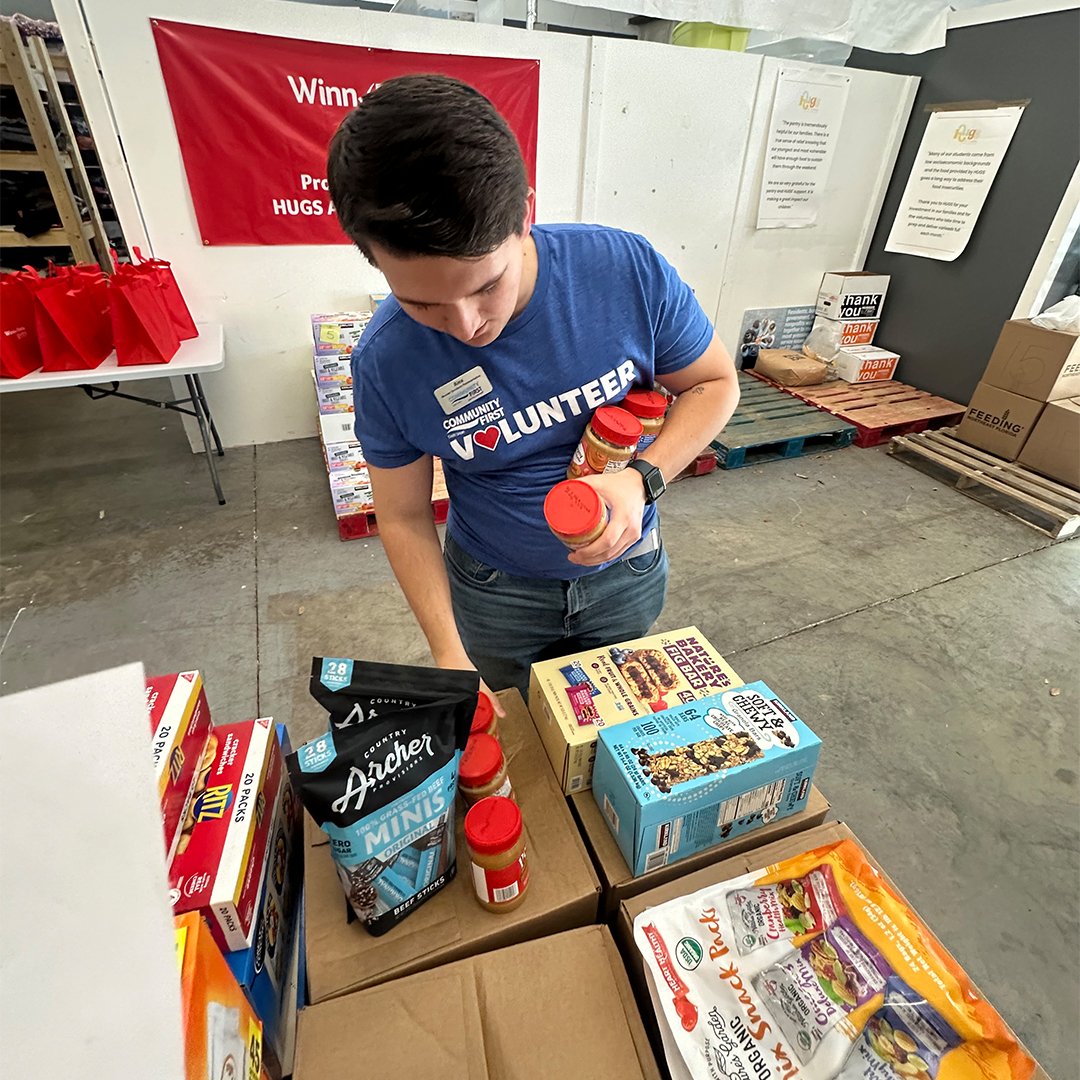 Volunteer sorting food.