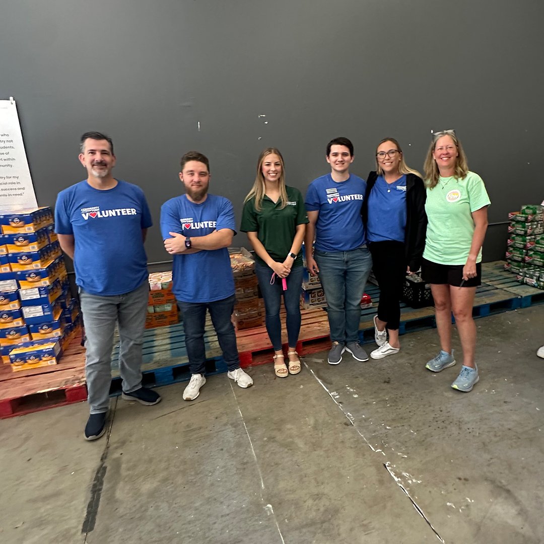 Volunteers smiling. Volunteers smiling.