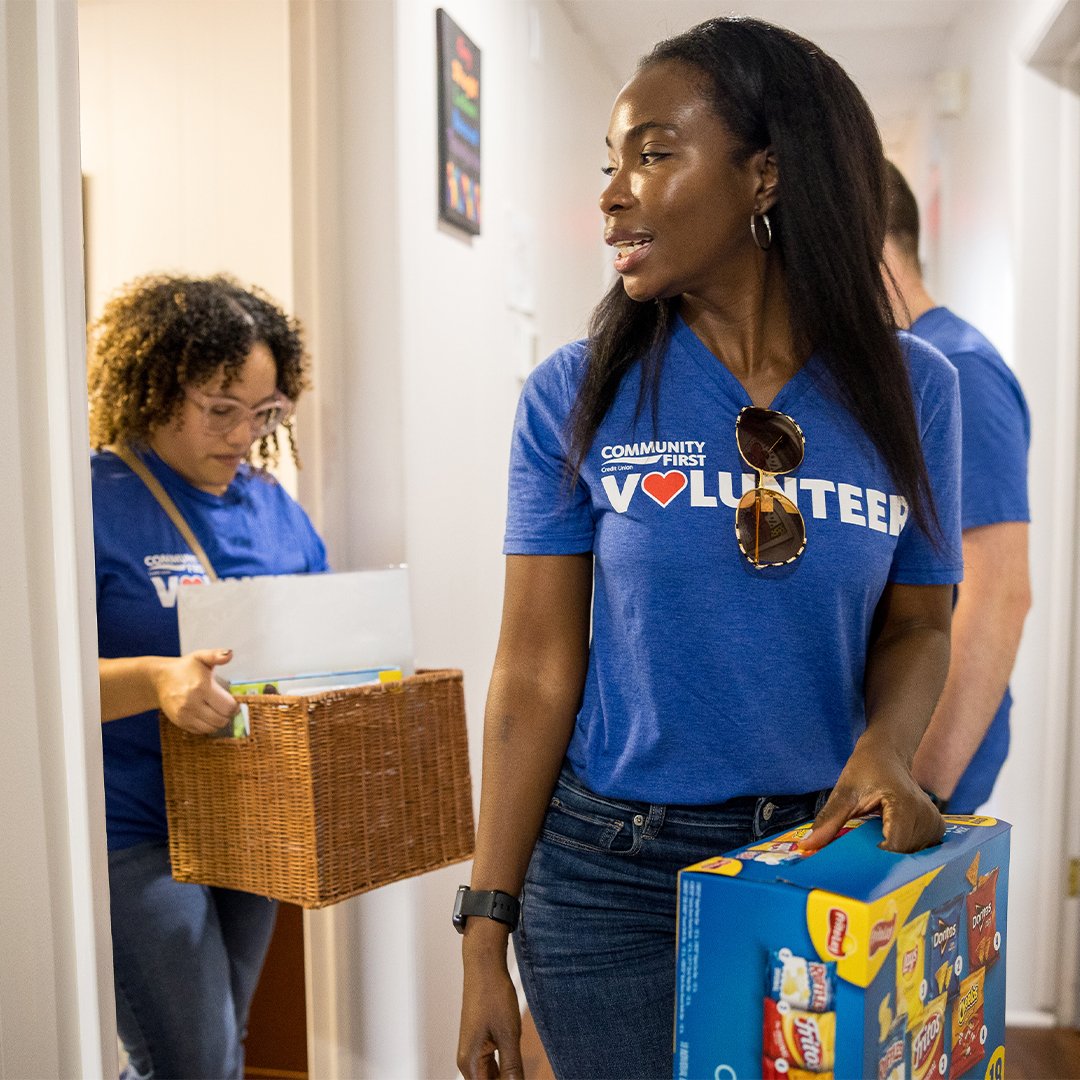 Volunteer holding supplies. Volunteer holding supplies.