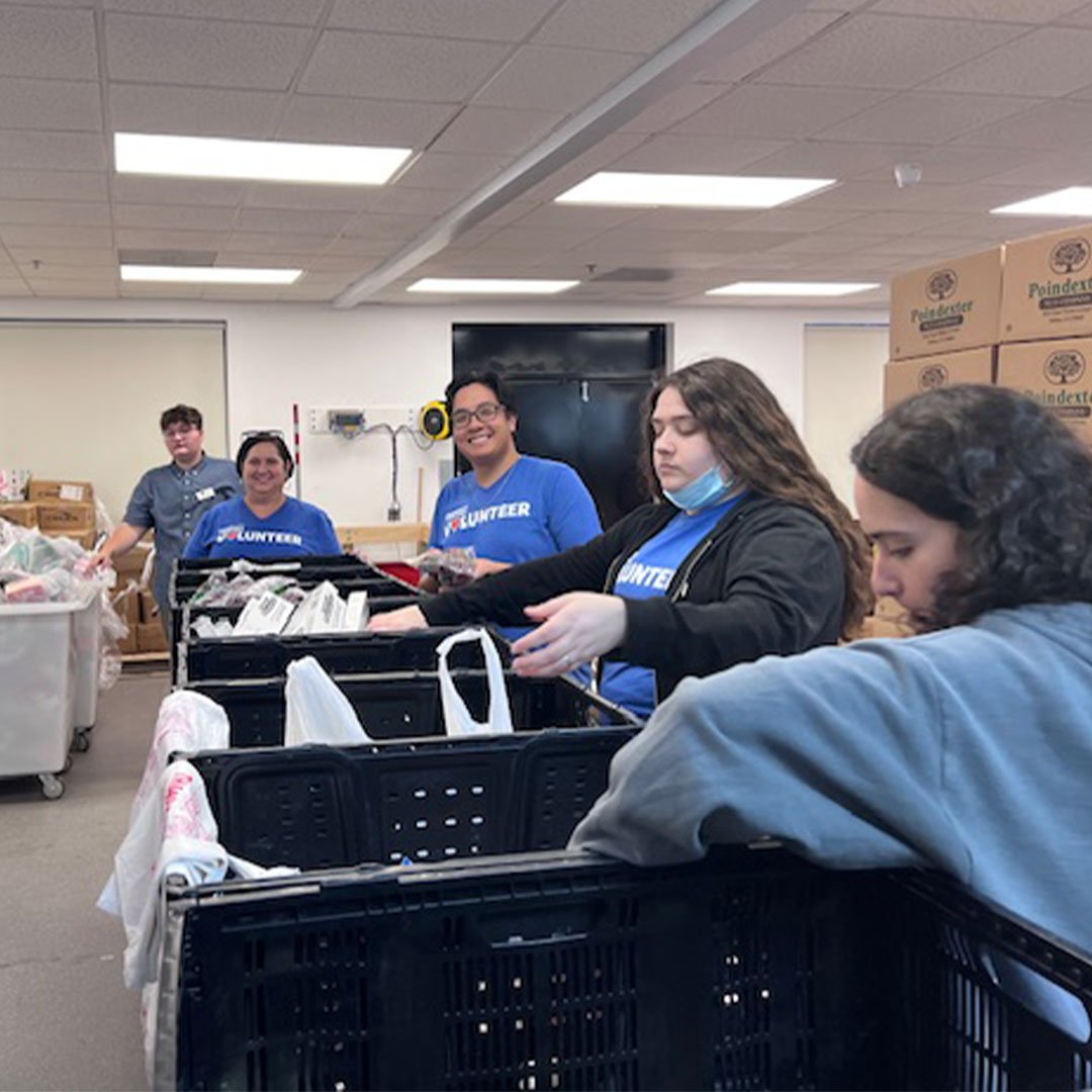 Volunteers packing food.