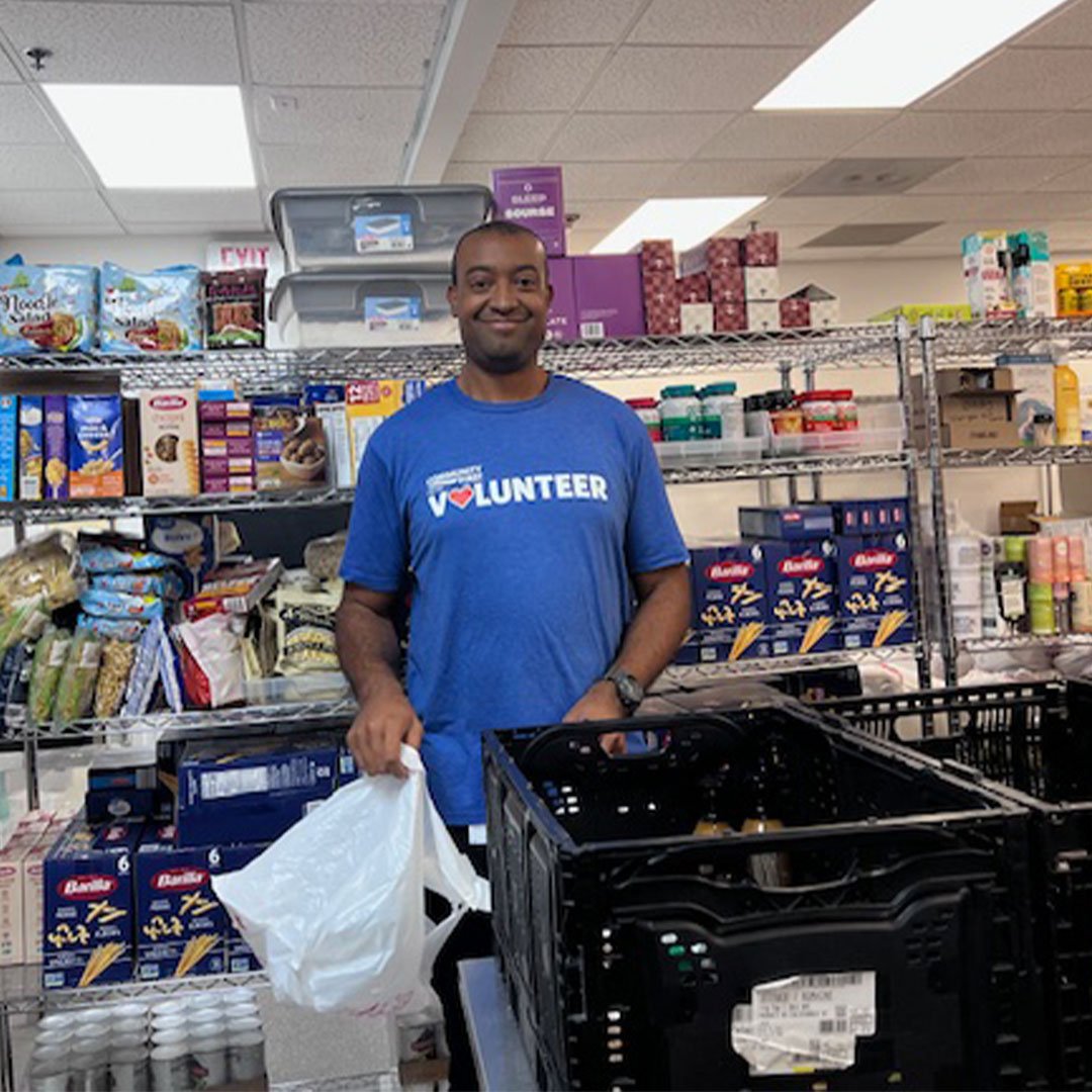 Volunteer packing food.