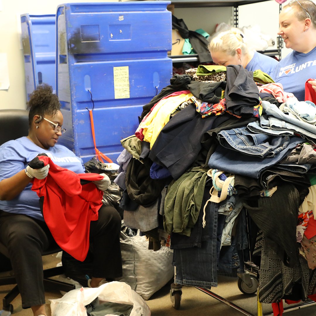 Volunteers sorting clothing Volunteers sorting clothing