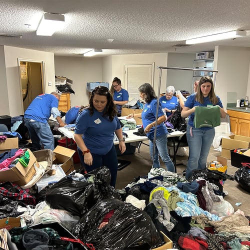 Volunteers sorting clothes.
