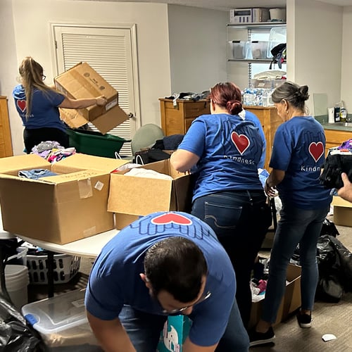 Volunteers sorting through boxes