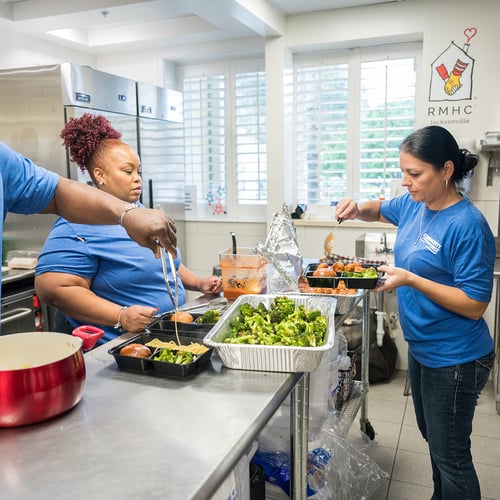 Volunteers prepping food.