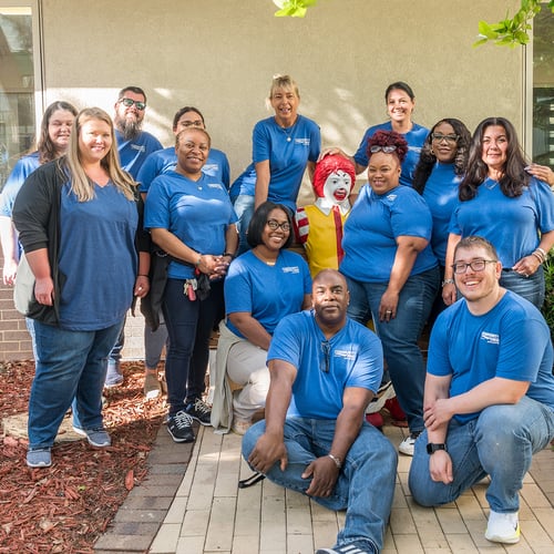 Volunteers posing as a group