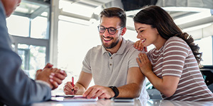 A couple look over loan paperwork A couple look over loan paperwork