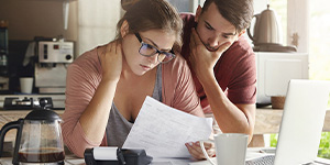 Couple looking at a bill.