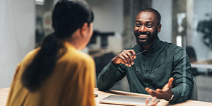 Woman talking to a man.